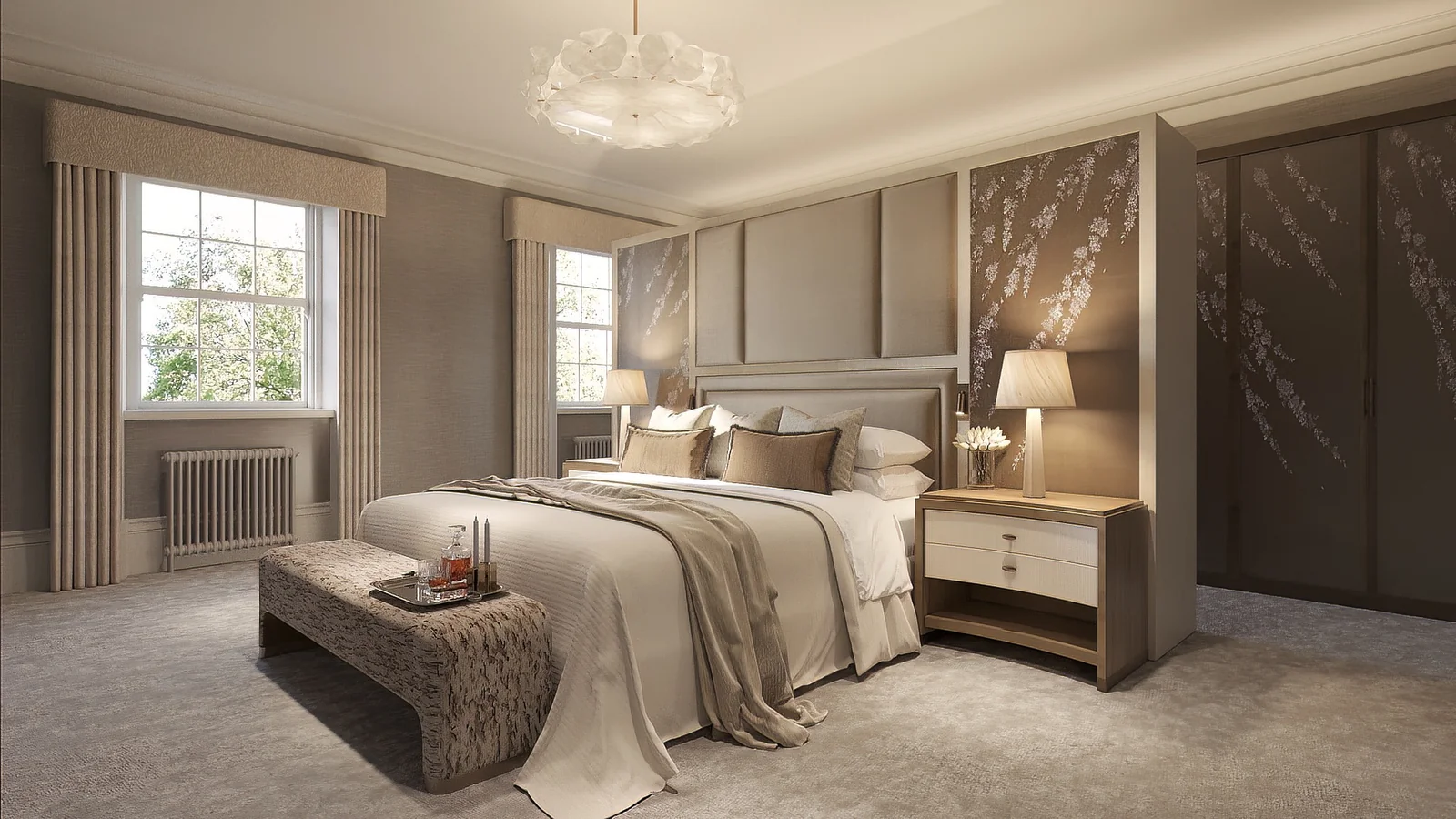 Layered neutral textiles and bedside furnishings in a hotel suite
